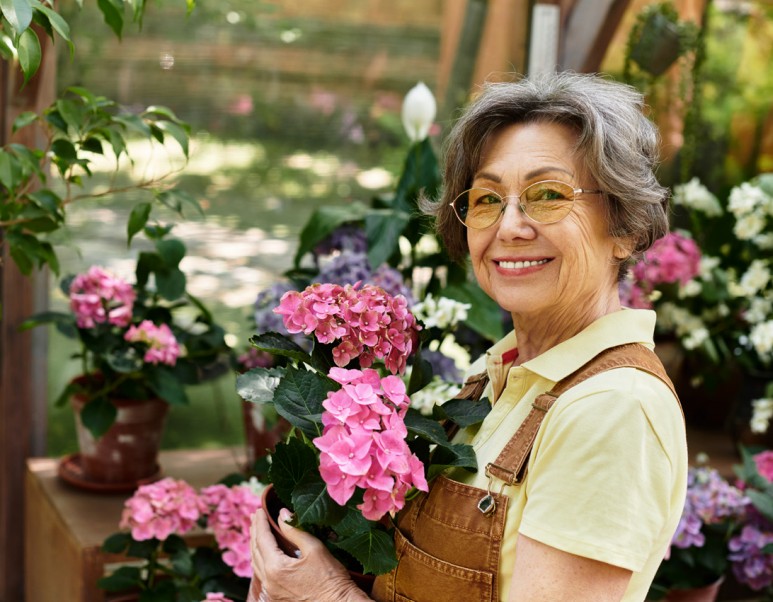 Smiling woman holding flowers