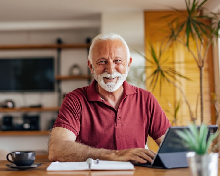 Smiling man on computer